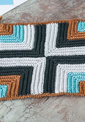 PANNENLAP IN GEOMETRISCH RELIEFPATROON Cotone van Lana Grossa