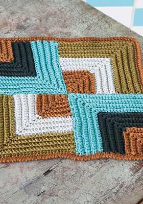 PANNENLAP IN GEOMETRISCH RELIEFPATROON Cotone van Lana Grossa